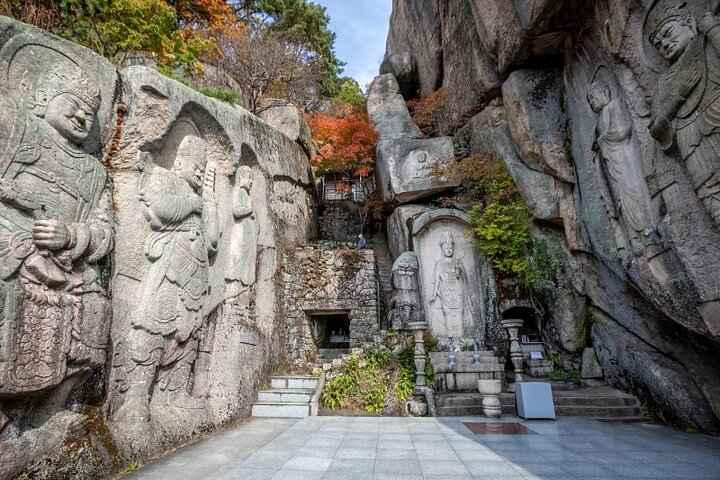 Marvel at the ancient stone carvings of Seokbulsa Temple where history and nature intertwine and explore breathtaking views from Geumjeongsan Fortress making for an unforgettable hiking adventure.